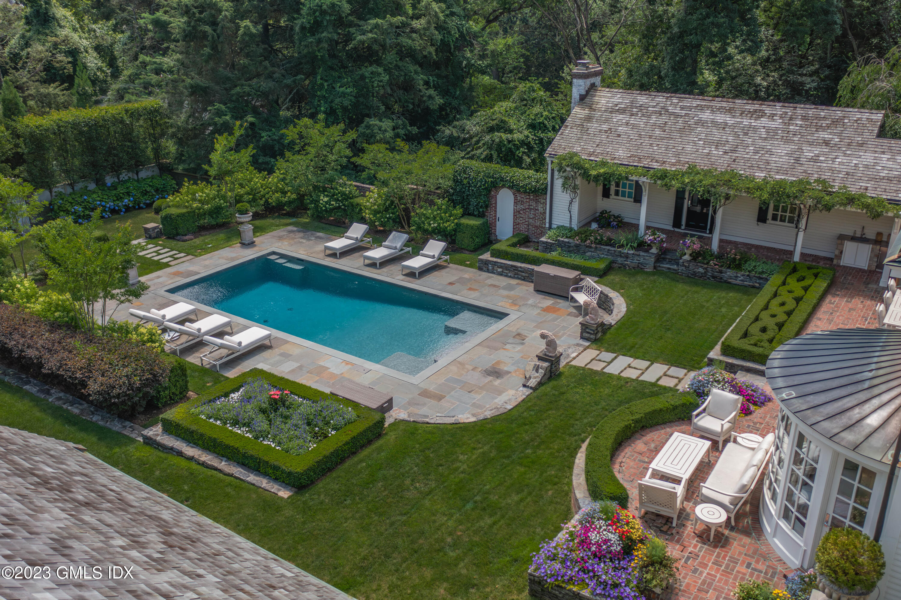 80 Round Hill Road Greenwich, CT 06831 - Photo 40 of 57 an aerial view of a house with a garden
