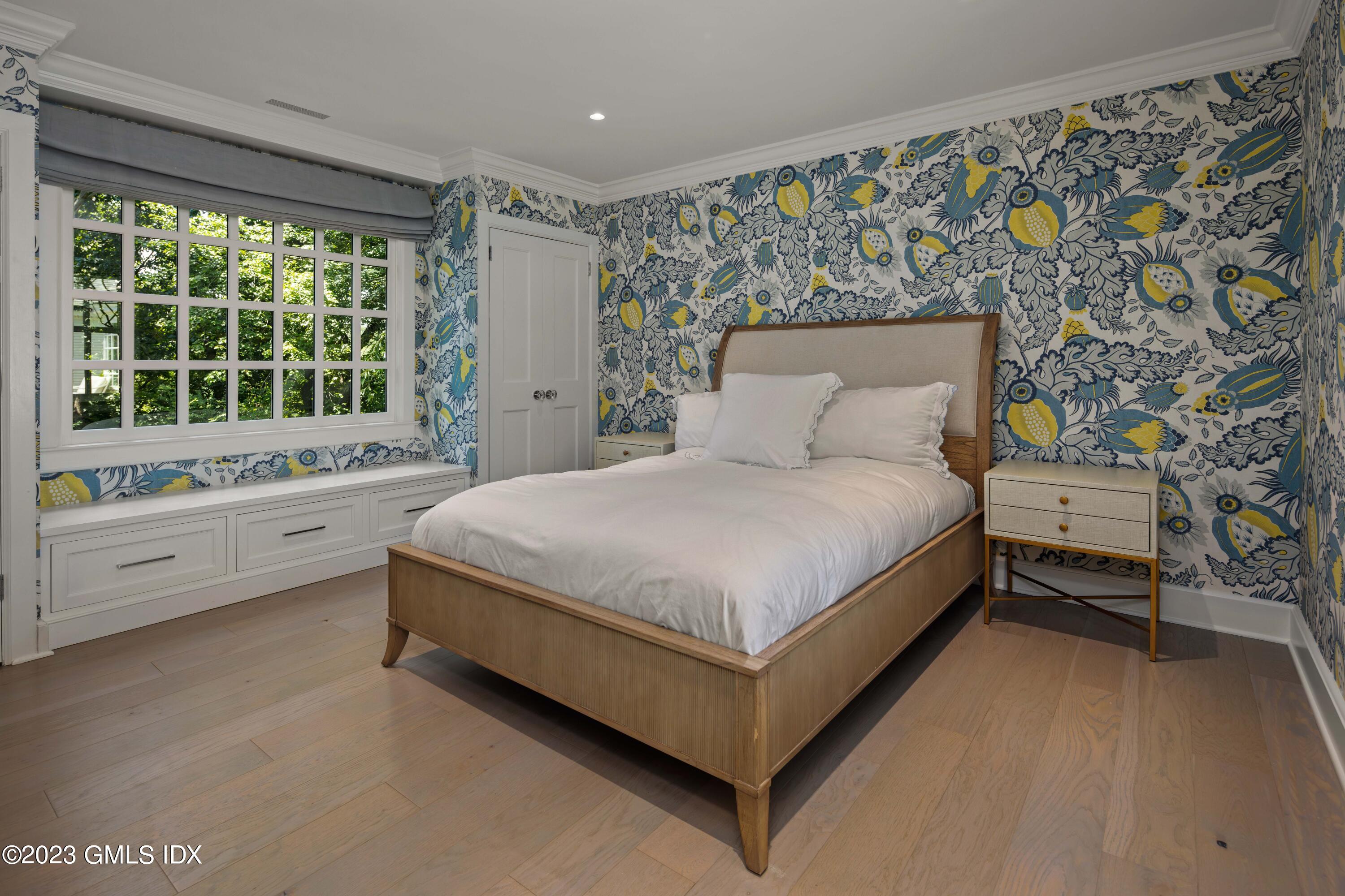 80 Round Hill Road Greenwich, CT 06831 - Photo 44 of 57 a spacious bedroom with a bed and a window