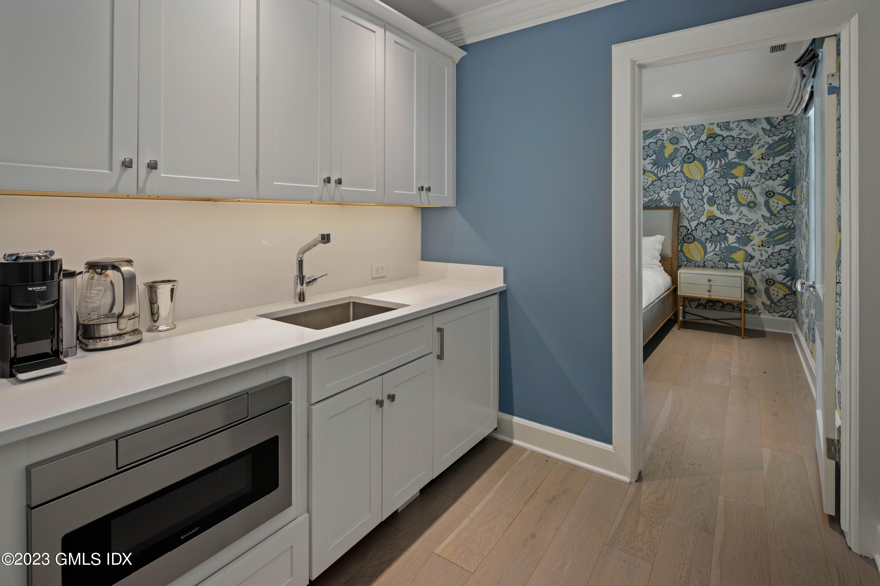 80 Round Hill Road Greenwich, CT 06831 - Photo 45 of 57 a kitchen with a sink and cabinets