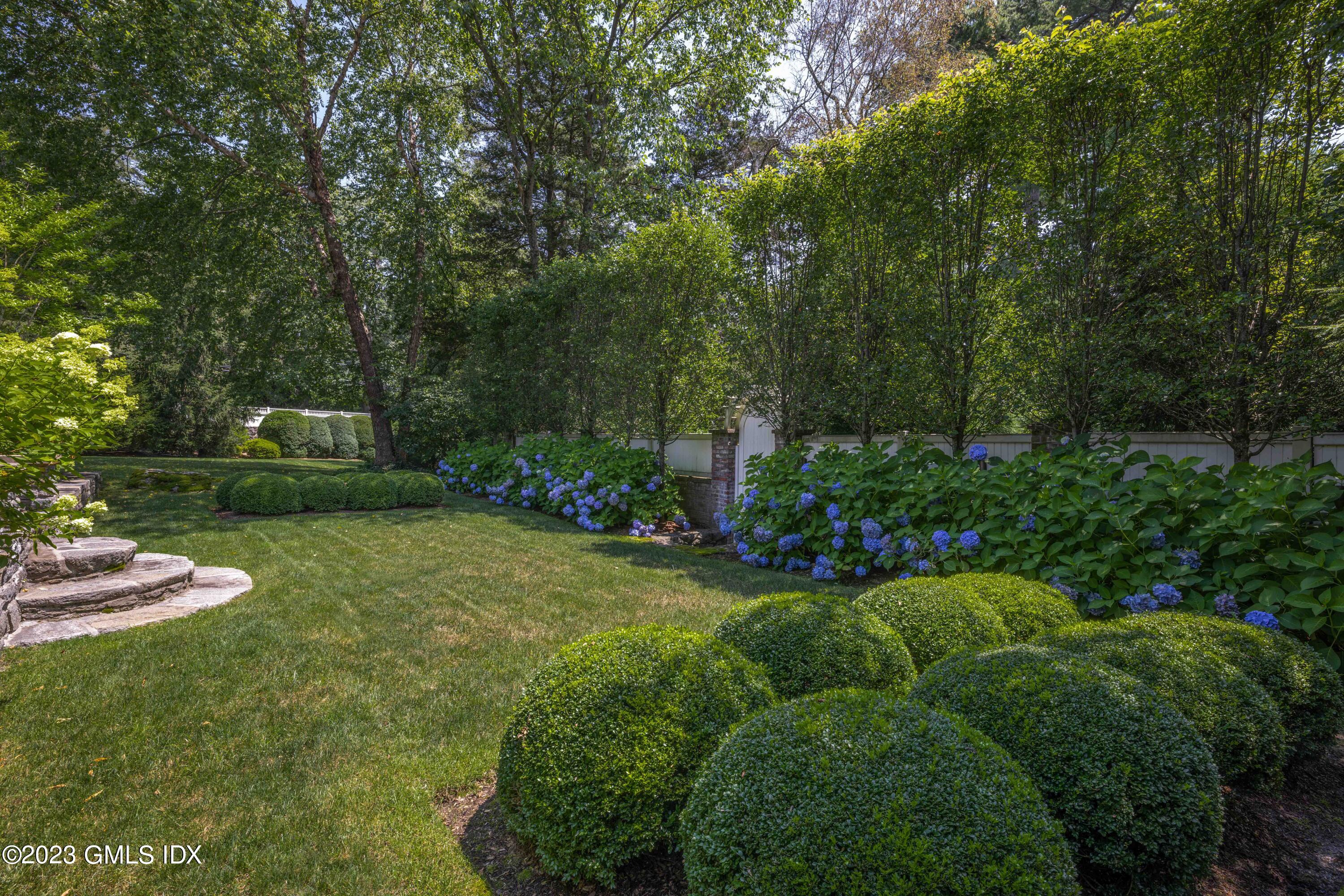 80 Round Hill Road Greenwich, CT 06831 - Photo 46 of 57 a garden view with a seating space