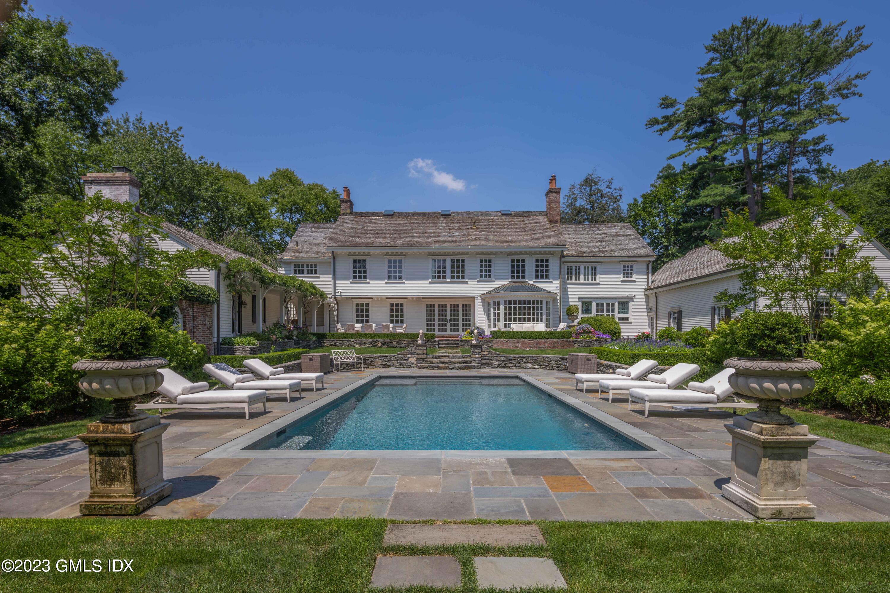 80 Round Hill Road Greenwich, CT 06831 - Photo 50 of 57 a view of a house with swimming pool and sitting area