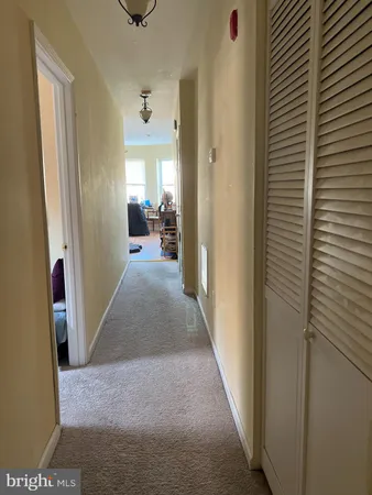 a view of a livingroom with furniture and a window