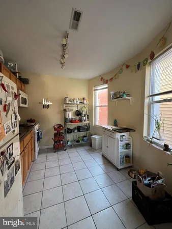 a kitchen with stainless steel appliances a sink and a stove
