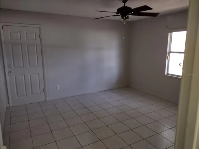 a view of storage and utility room with wooden floor