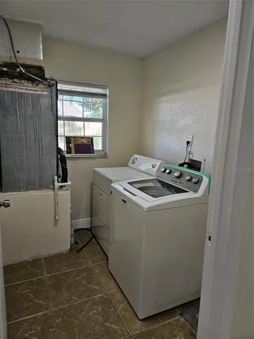 a kitchen with a sink appliances and cabinets