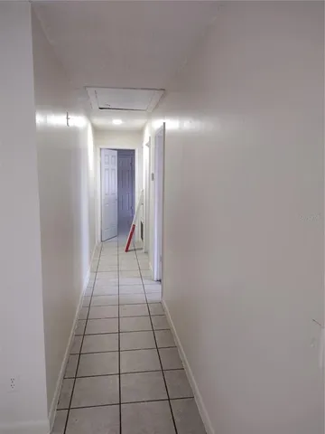 a kitchen with a refrigerator and a sink