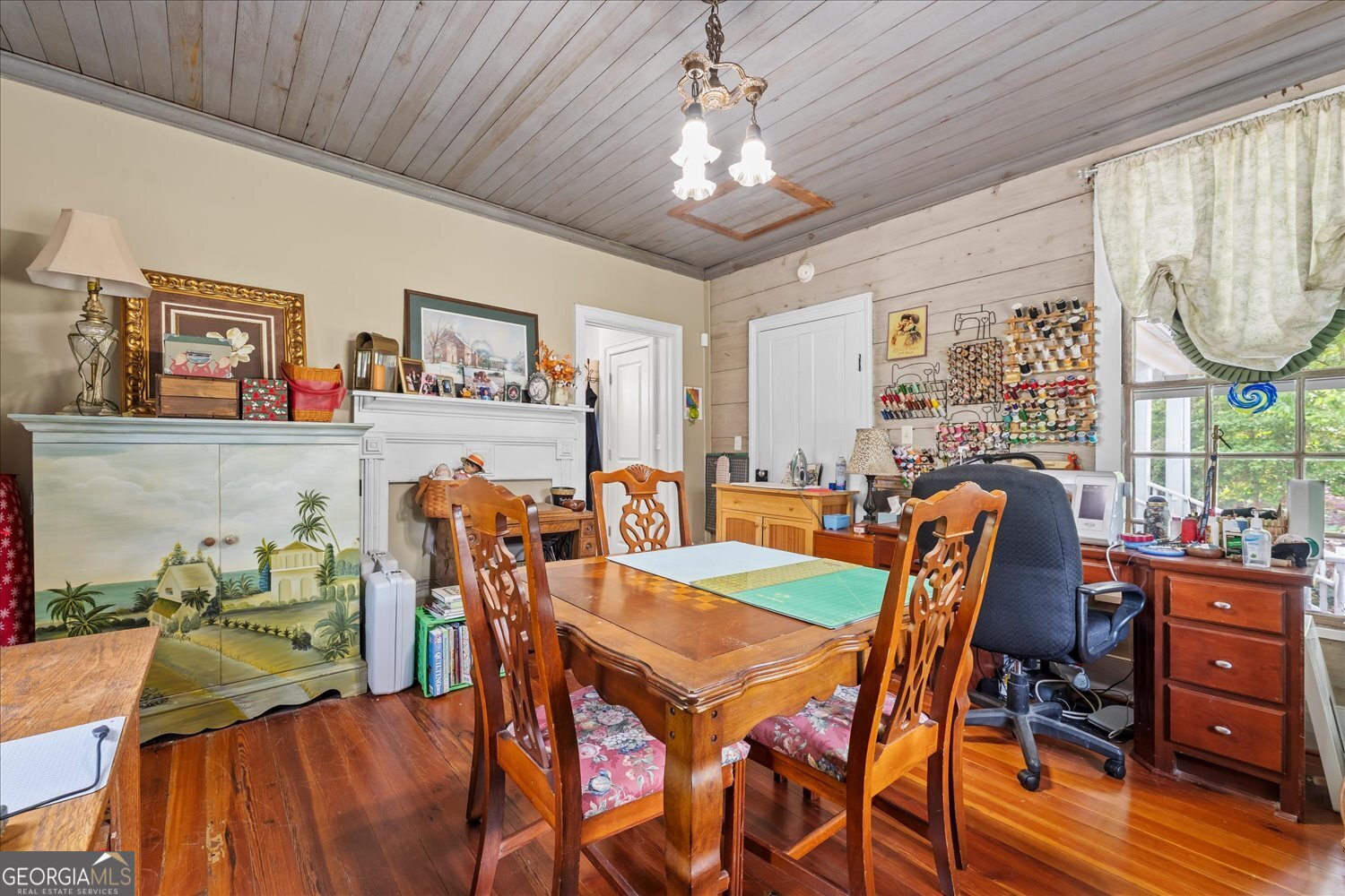 6644 East Cadley Road Norwood, GA 30821 - Photo 16 of 53 a view of a dining room with furniture and wooden floor
