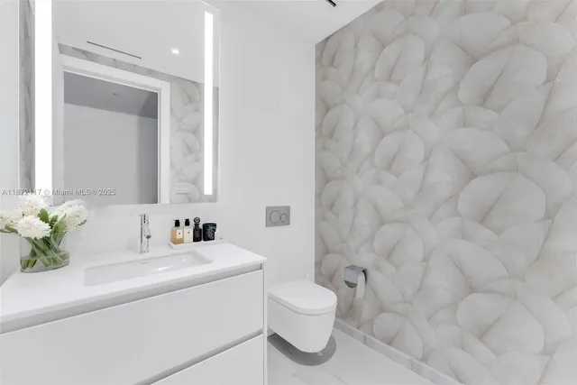 a bedroom with a bed and painting on the wall