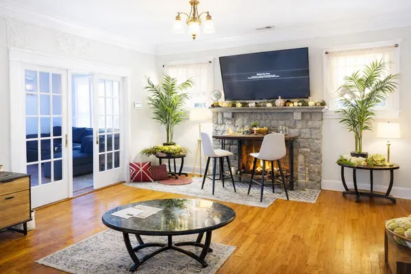 a living room with furniture and a flat screen tv