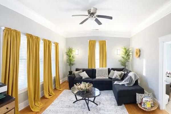 a spacious bedroom with a bed and window