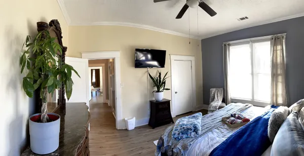 a view of entryway and hall with wooden floor