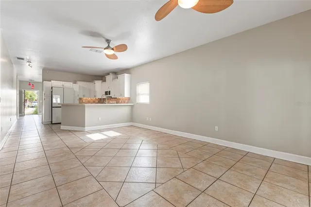 a view of a kitchen with a sink and cabinets