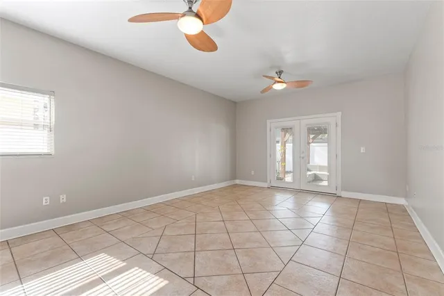 a view of an empty room with a window