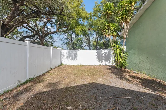 a view of a yard with a tree