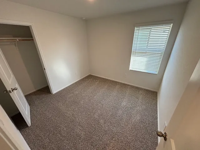 a view of a room that has a window in it