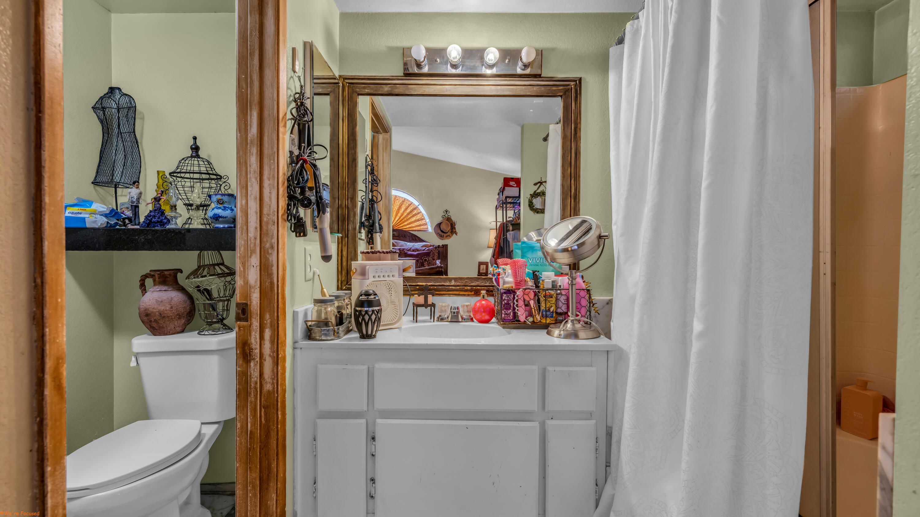 80928 Brown Street Indio, CA 92201 - Photo 21 of 33 a bathroom with a toilet sink and mirror