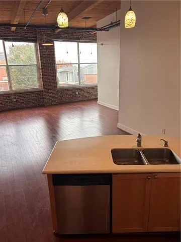 a kitchen with a sink and a window