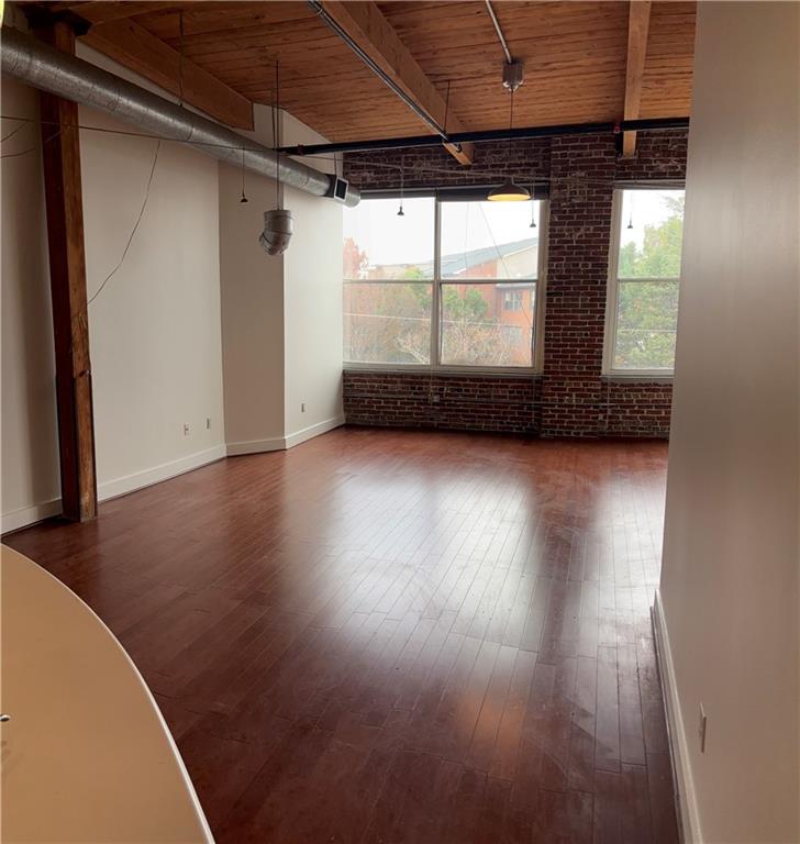 204 Walker Street Southwest, Unit 314 Atlanta, GA 30313 - Photo 2 of 42 a view of a room with wooden floor and window