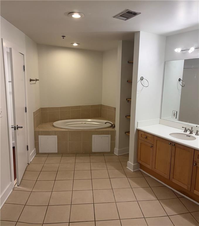 204 Walker Street Southwest, Unit 314 Atlanta, GA 30313 - Photo 25 of 42 a bathroom with a sink a toilet and shower