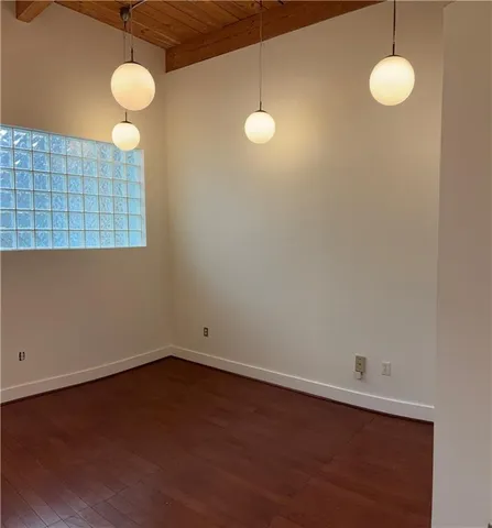 a view of a room with a fan and window