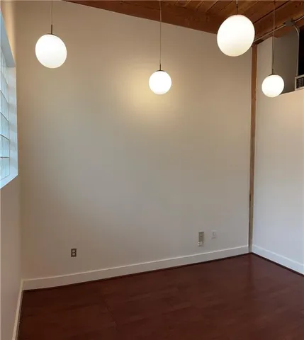 a view of a livingroom with wooden floor