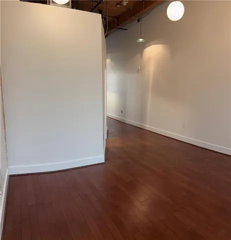 a view of a refrigerator in wooden floor