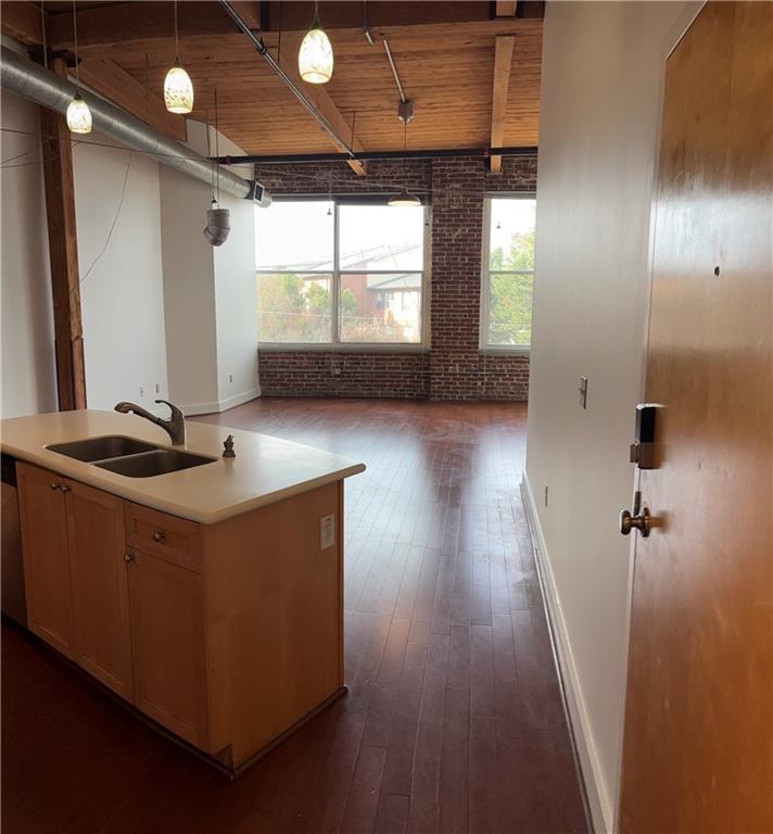204 Walker Street Southwest, Unit 314 Atlanta, GA 30313 - Photo 35 of 42 a room with wooden floors and window