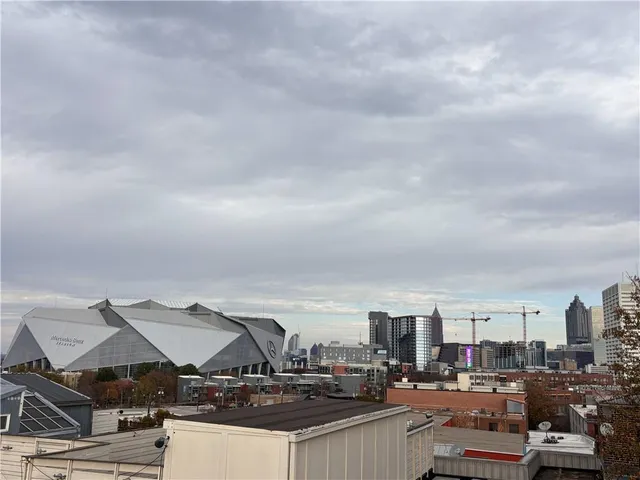 a view of a roof deck with patio