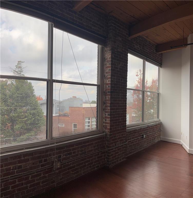 204 Walker Street Southwest, Unit 314 Atlanta, GA 30313 - Photo 4 of 42 a view of an empty room with a window