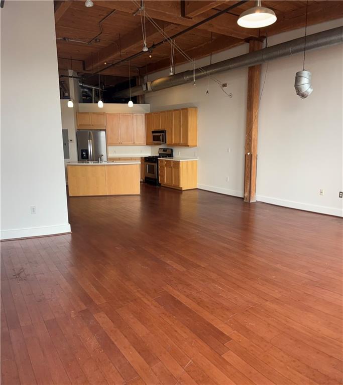 204 Walker Street Southwest, Unit 314 Atlanta, GA 30313 - Photo 6 of 42 a view of a kitchen with a sink and a refrigerator