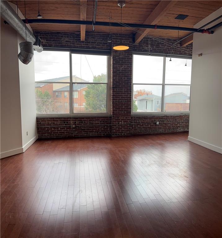 204 Walker Street Southwest, Unit 314 Atlanta, GA 30313 - Photo 8 of 42 a view of room with window and wooden floor