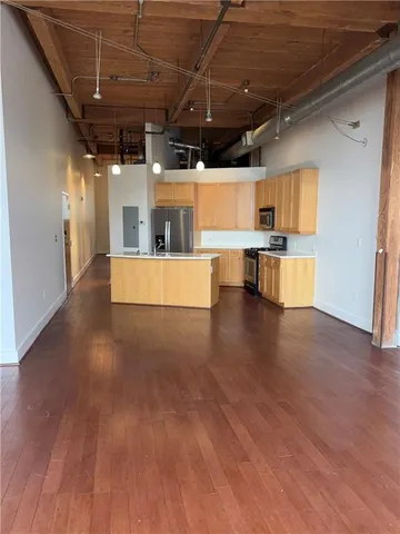 a view of a kitchen with a sink and a microwave