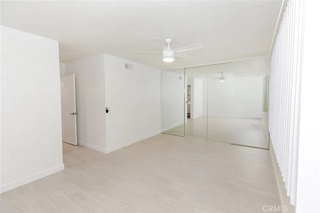 a view of a bedroom from a hallway