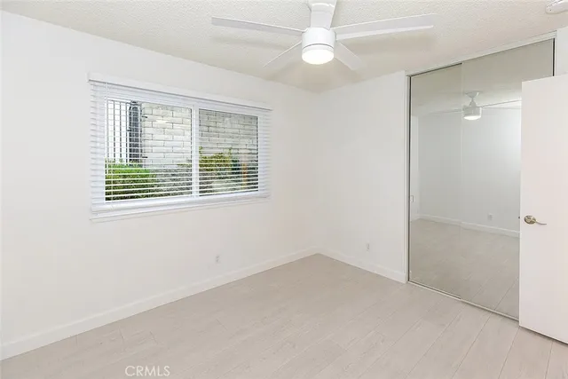 a view of a house with backyard and a tree