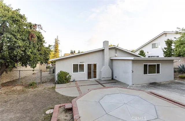 a view of a house with a yard and garage