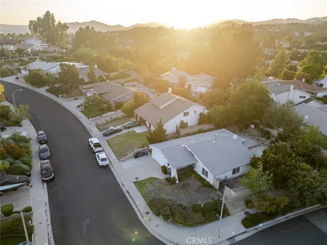 an aerial view of a house with a swimming pool