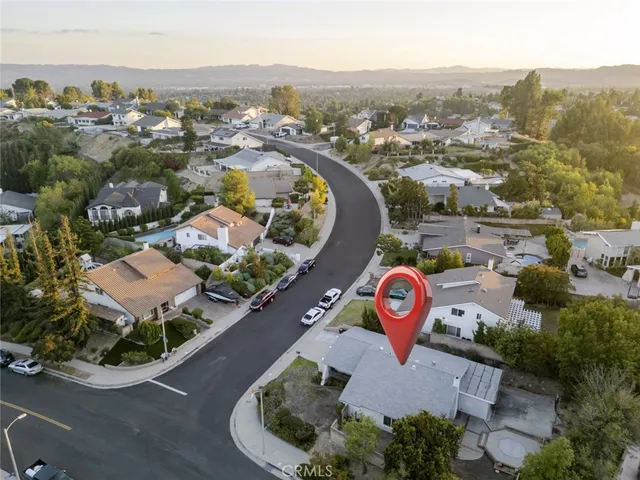 an aerial view of a house with a garden