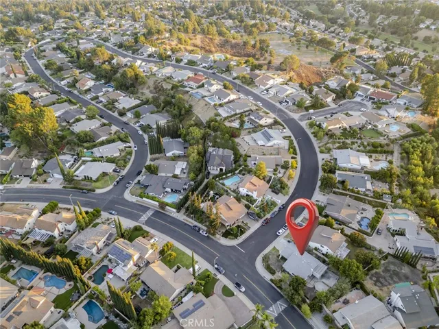a view of a house with a sink yard and mountain view in back