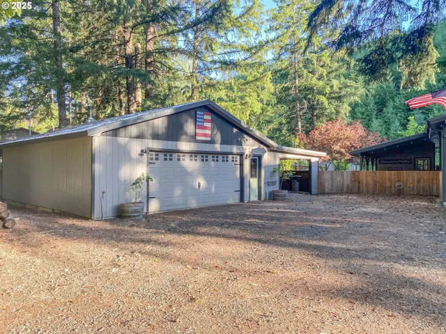 a front view of a house with a yard and a garage