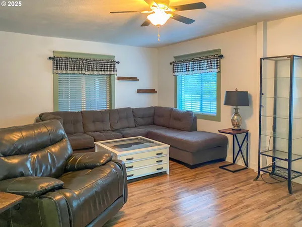 a living room with furniture and a window