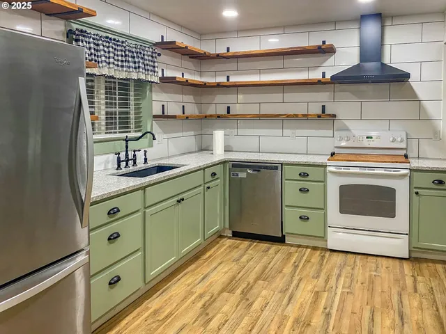 a kitchen with a stove and cabinets