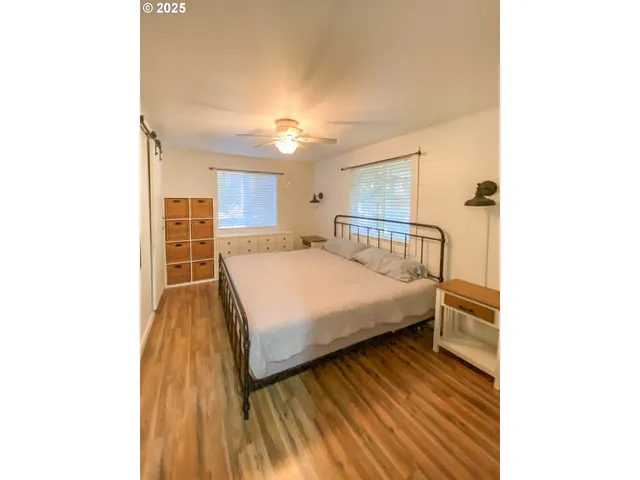 a bedroom with a bed and a cabinets