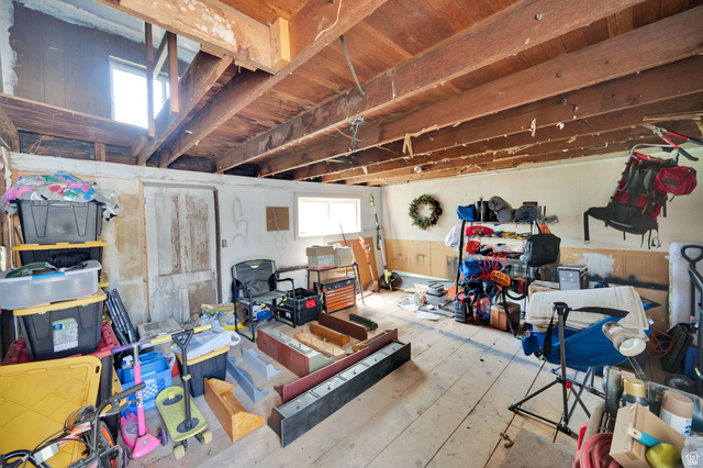 501 Canyon Road Ogden, UT 84404 - Photo 29 of 30 Exposed wooden ceiling beams spanning across the space, with natural light entering through two windows