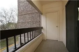 a view of balcony with wooden floor