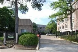 a view of a street with a building in the background