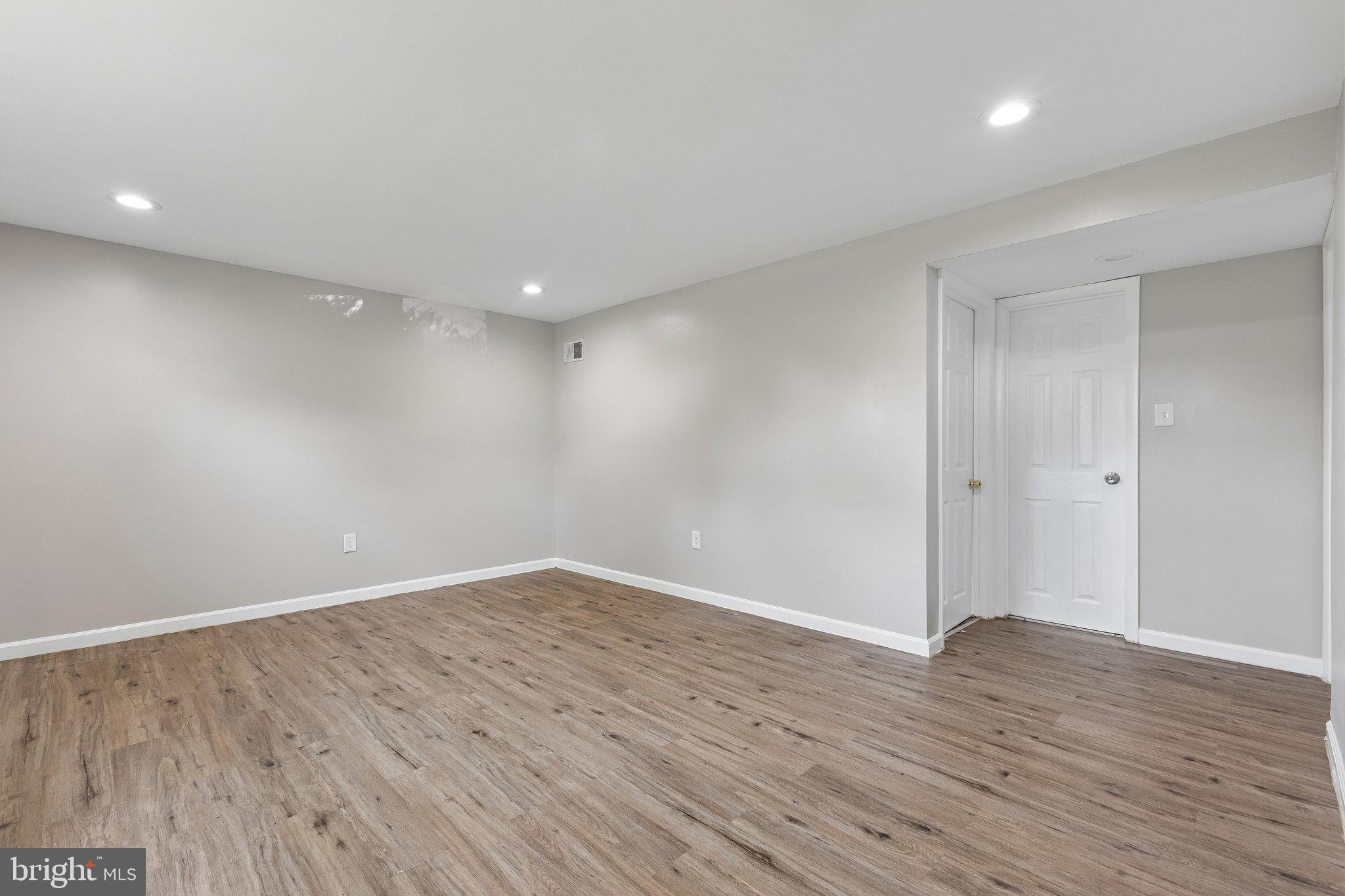 14197 Fullerton Road Woodbridge, VA 22193 - Photo 8 of 23 a view of an empty room with wooden floor