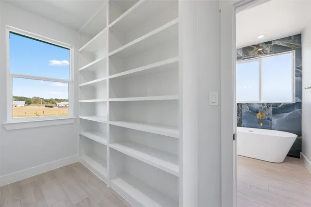 a bathroom with a sink mirror and vanity