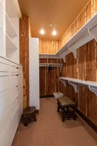 a balcony with wooden floor and furniture