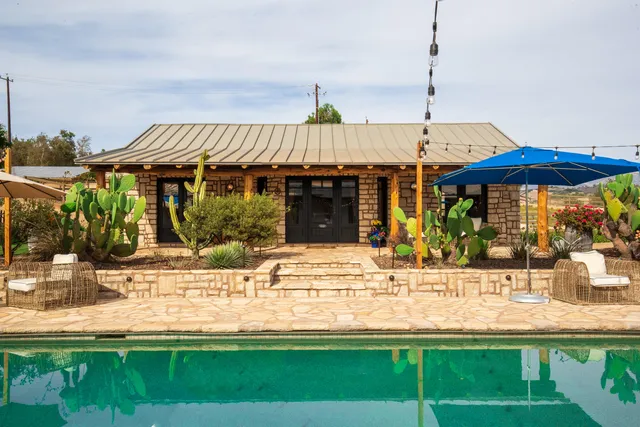 a view of a house with a swimming pool
