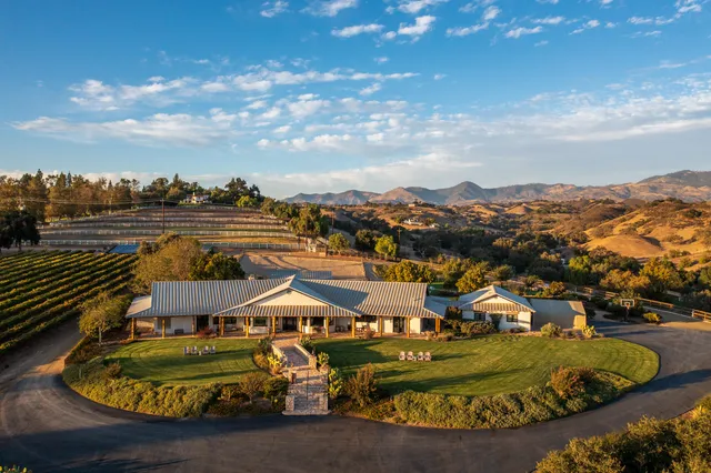 aerial view of a house with a big yard